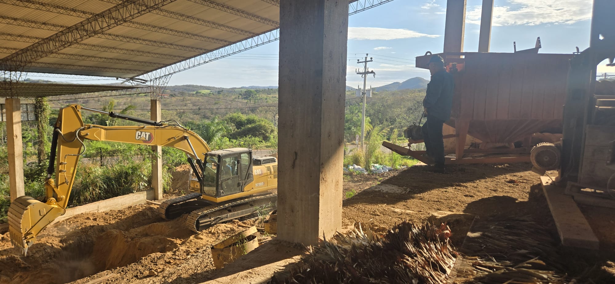 Excavator carrying out earthwork at an active project site